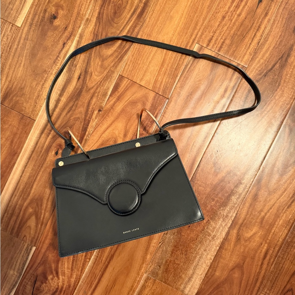 Danse Lente Black Leather Crossbody Bag with Circular Hardware